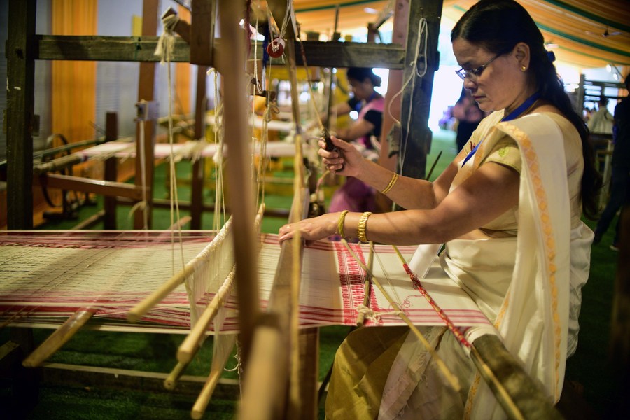 An artisan weaving Eri silk, showcasing the Northeast’s rich handloom tradition.